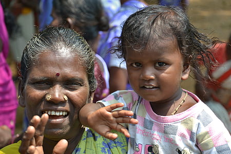 woman carrying child thumbnail