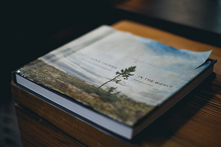book on brown surface thumbnail