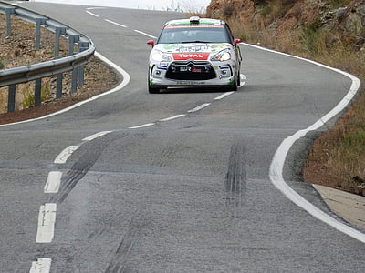 Citroen C3 on winding road near rail and grasses thumbnail