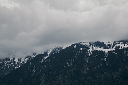 Snow-capped Mountain Under Cloudy Sky thumbnail