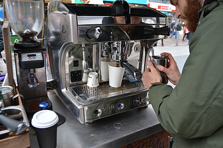 person using espresso maker thumbnail