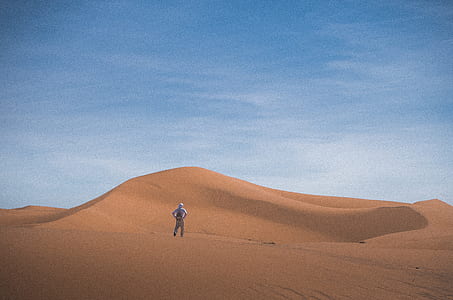 person standing on desert thumbnail
