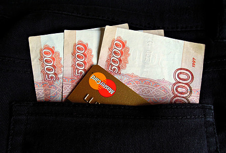 brown MasterCard on three 5000 banknotes thumbnail