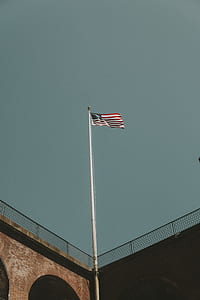 low angle photography of American flag at daytime thumbnail