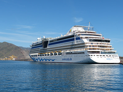 white cruise ship surrounded by body of water thumbnail