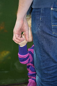 person wearing blue jeans holding girl wearing pink shirt thumbnail