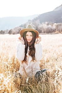 Photography of Woman on Brown Field thumbnail