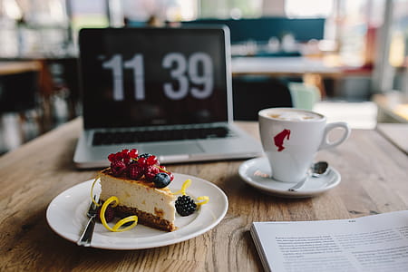 Working in a restaurant: Macbook, Cheese Cake and Cup of Coffee thumbnail