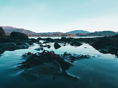 rock formations in body of water thumbnail