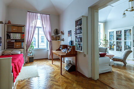 brown wooden desk near white wooden bed thumbnail