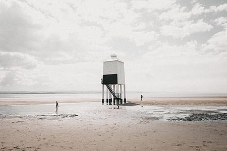 white lifeguard house on seashore thumbnail