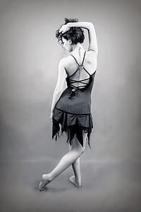 grayscale photo of a woman in backless dress posing for a photo thumbnail