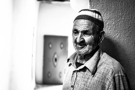 grayscale photography of man in button-up collared shirt thumbnail