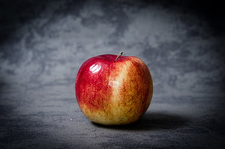 red and yellow apple fruit on gray surface in close up photo thumbnail