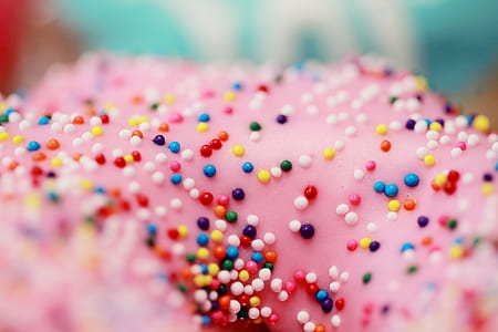 macro photography of doughnut with multicolored sprinkle toppings thumbnail