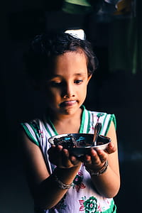 boy holding stainless steel bowl thumbnail