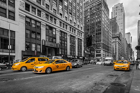 selective color photography of three orange taxis thumbnail