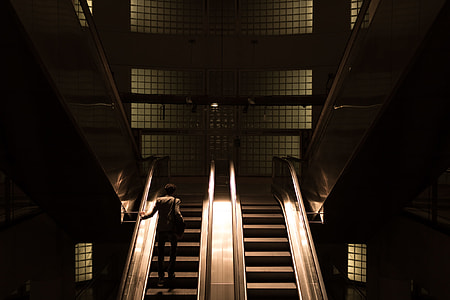 person going up the escalator thumbnail