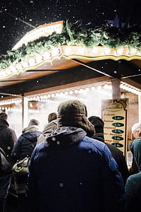 people standing in front of establishment during night thumbnail