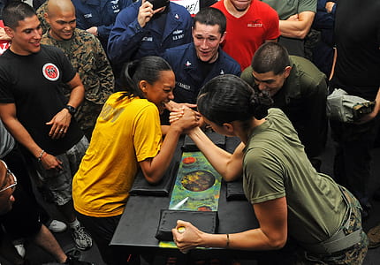 two women doing arm wrestling thumbnail