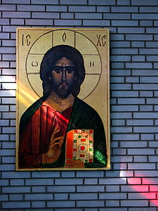 Jesus Christ painting mounted on brick wall thumbnail