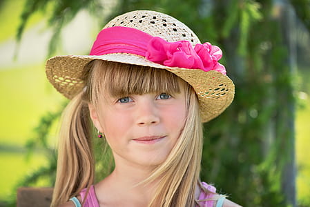portrait photography of blonde haired with brown sun hat thumbnail