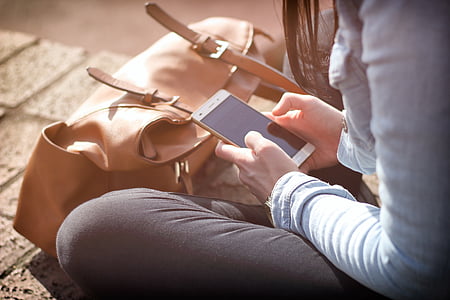 girl holding smartphone thumbnail