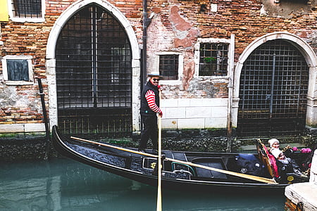 man paddling boat over river thumbnail