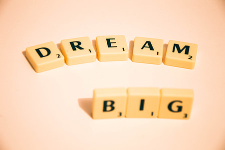 Dream Big scrabble letters on top of white surface thumbnail
