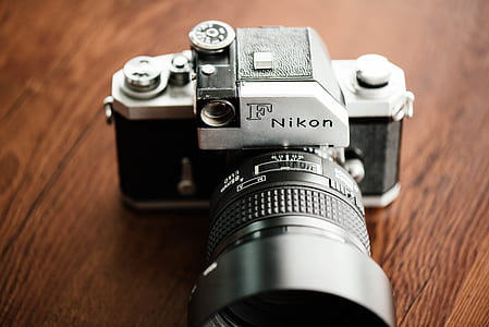 gray and black F Nikon DSLR camera thumbnail