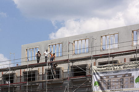 group of people climbing on scaffolding thumbnail