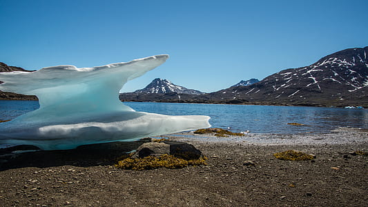 ice berg on land during daytime thumbnail