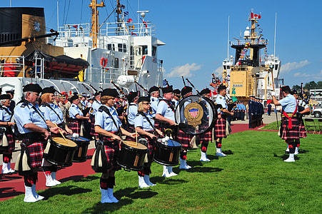 band playing on port near the ship at daytime thumbnail