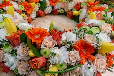 variety of flowers wreath on brown surface thumbnail
