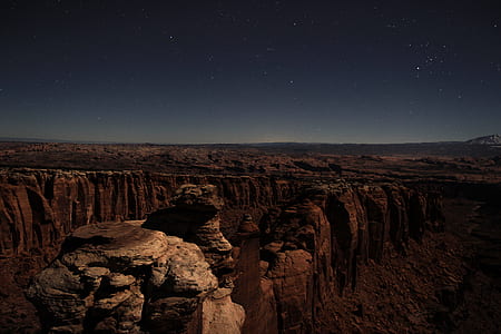 brown rocky mountain under blue sky photo thumbnail
