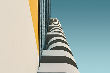 white and yellow building in low angle photography thumbnail