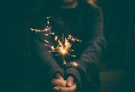 person holding handheld sparkler thumbnail