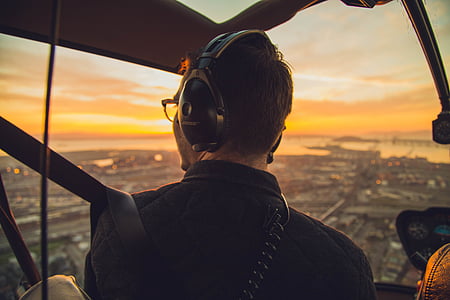 pilot inside cockpit at golden hour thumbnail