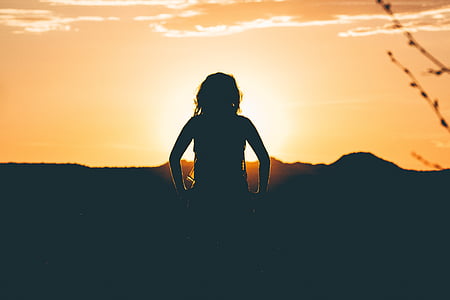silhouette of woman during sunset thumbnail