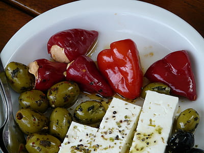 olives and red bell peppers in white plate thumbnail