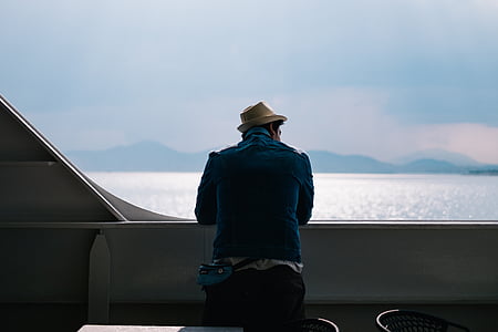 man standing near beach during daytime thumbnail