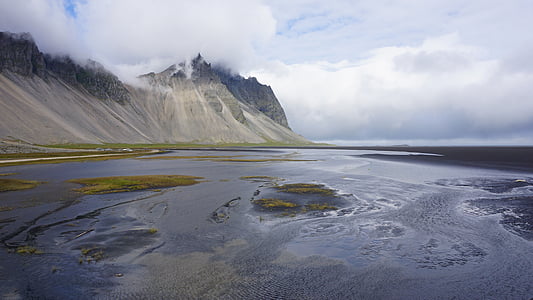 body of water near mountain thumbnail