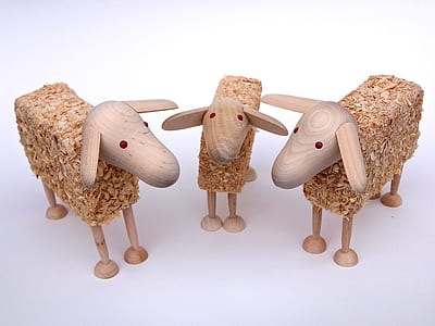 three brown wooden sheep carving thumbnail