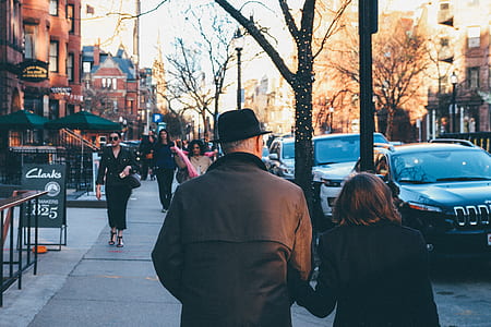 Man in Black Hat Holding His Wife thumbnail