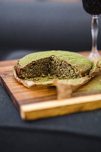 Delicious homemade matcha cake on a wooden board thumbnail