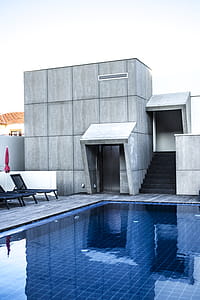 Black Loungers Near Blue Swimming Pool thumbnail