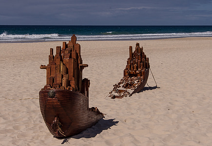 Titanic miniature on sand near shoreline thumbnail