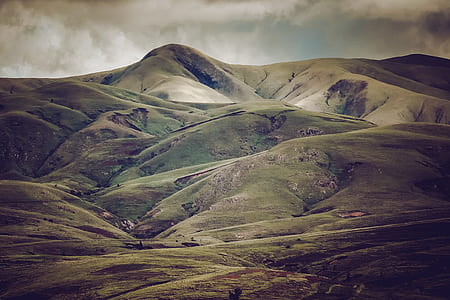 green mountain during daytime thumbnail
