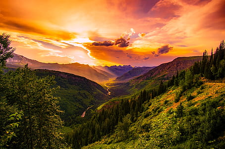 Green Mountain Near River Under Cloudy Sky during Daytime thumbnail