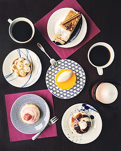 high angle photography of five pastries on top of plate beside two mugs thumbnail